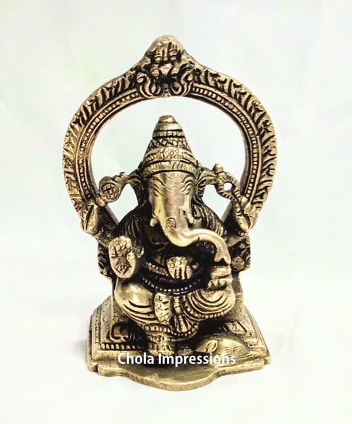 Vinayagar Brass Statue with Prabavali - 13 cm x 8 cm Vinayagar Brass Statue with Prabavali - 13 cm x 8 cm