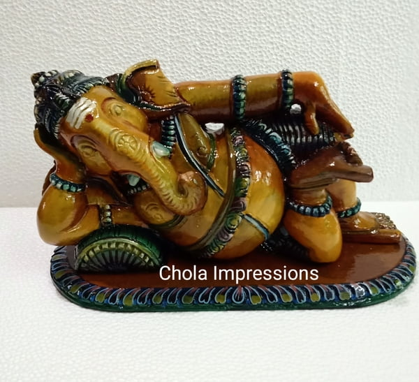 Reclining Vaastu Ganesh (Vaastu Vinayagar) Wooden statue - Coloured Antique Style Reclining Vaastu Ganesh (Vaastu Vinayagar) Wooden statue - Coloured Antique Style