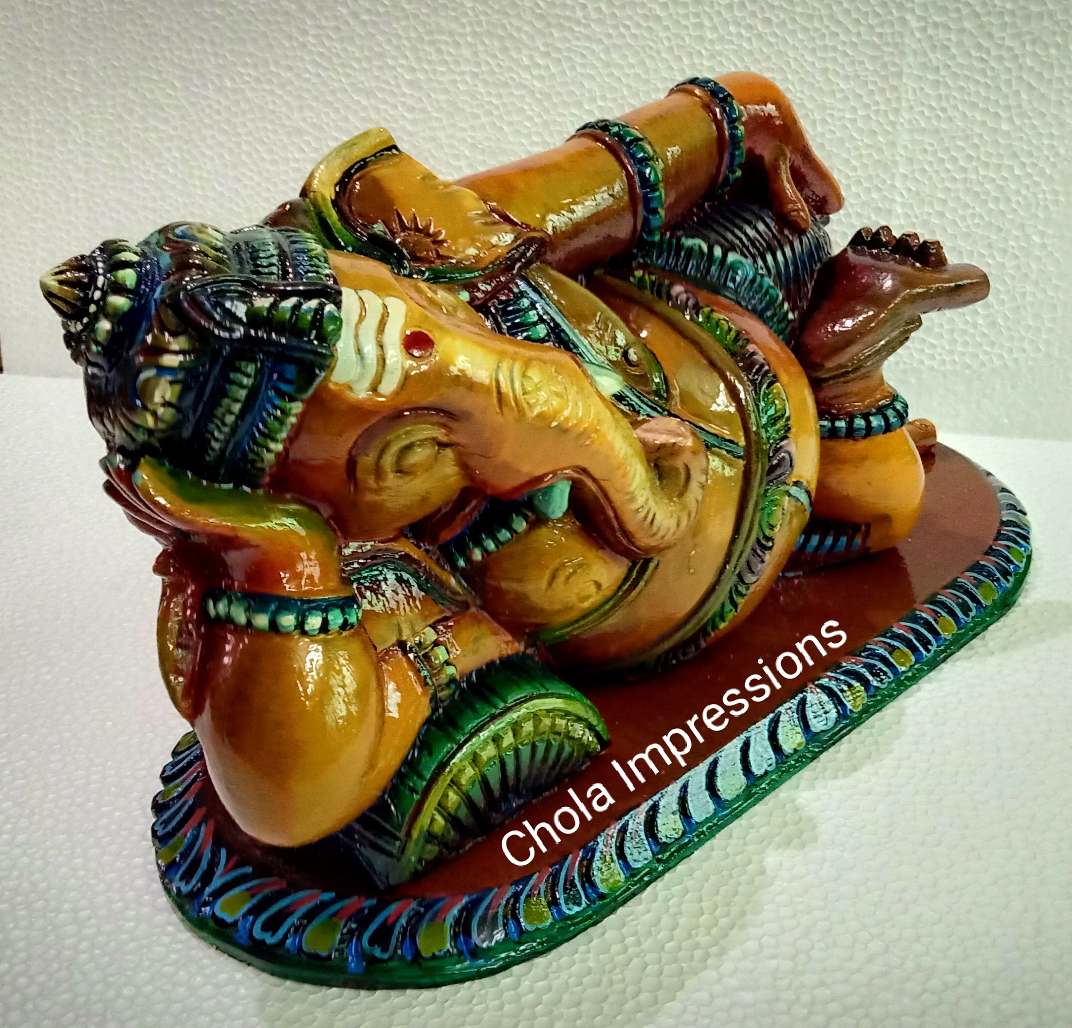 Reclining Vaastu Ganesh (Vaastu Vinayagar) Wooden statue - Coloured Antique Style Reclining Vaastu Ganesh (Vaastu Vinayagar) Wooden statue - Coloured Antique Style
